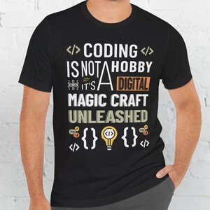 May include: Black t-shirt with a white graphic that reads "</> CODING </> IS NOT A HOBBY IT'S A DIGITAL MAGIC CRAFT UNLEASHED" with code symbols and a lightbulb.