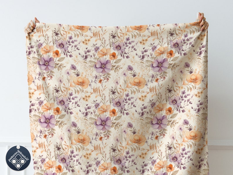 May include: A beige fabric with a floral pattern featuring purple and orange flowers. The fabric has a subtle texture and a vintage aesthetic.
