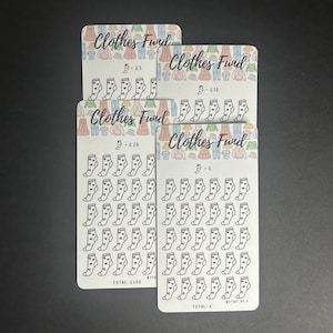 May include: Four white cards with rounded corners, each printed with "Clothes Fund" and sock illustrations. The cards are marked with amounts of £5, £10, £20, and an empty one. The top of each card has a clothing pattern.