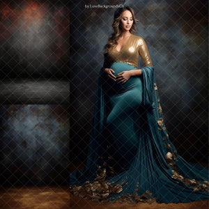 May include: A pregnant woman wearing a teal gown with gold sequins and a matching long, flowing cape. The gown is fitted and hugs her figure, with the cape flowing behind her. The background is a dark, textured wall.
