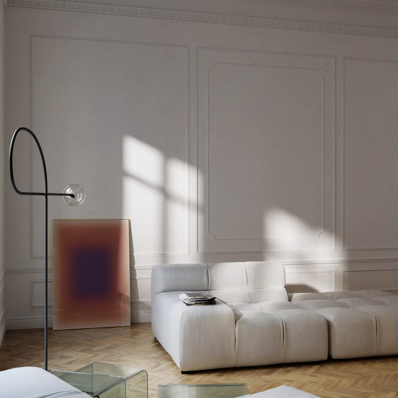 May include: A white modular sofa with a textured fabric, positioned in a room with white walls and a large abstract painting on the wall. The sofa is made up of multiple individual pieces that can be arranged in different configurations.