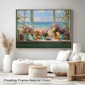 Puede incluir: Impresión en lienzo enmarcada que presenta un vibrante arreglo floral en jarrones sobre un alféizar con vistas a una playa. La obra de arte muestra una variedad de flores y mariposas coloridas, con el texto "Floating Frame-Natural Color" en la parte inferior.
