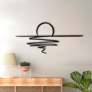 Arte de pared de metal con destellos solares: colgante de pared geométrico con amanecer