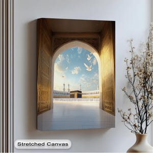 Kaaba View Through Golden Arch Canvas Wall Art, Peaceful Mecca Scene with Doves, Islamic Home Decor with Black Floating Frame