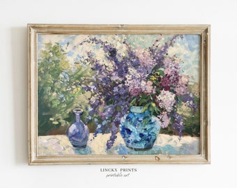 May include: A framed painting of a still life featuring a bouquet of purple lilac flowers in a blue and white vase, and a smaller blue vase on a white tablecloth.
