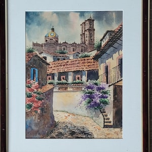 May include: Watercolor painting of a townscape with buildings, a church, and a cobblestone street. The painting features a domed church with a yellow and gold dome, and a tall bell tower. The buildings have red tile roofs and colorful walls.