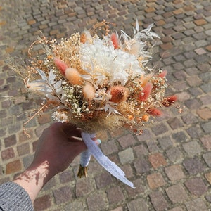 Bridal bouquet of dried peach flowers