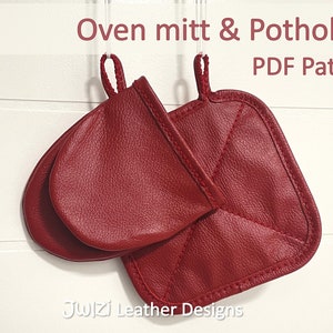 May include: A red leather oven mitt and potholder hanging on hooks. The oven mitt is a simple design and the potholder has a quilted design. The text "Oven mitt & Potholder PDF Pattern" is at the top of the image. The text "Juizi Leather Designs" is at the bottom of the image.