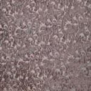 May include: Close-up of patterned fabric featuring a repeating floral design in brown and cream hues. The fabric has a textured surface, with raised floral elements. The overall effect suggests a vintage or antique style.