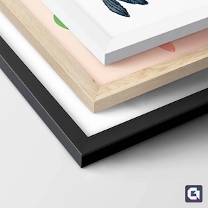May include: Three picture frames stacked on top of each other. The top frame is white, the middle frame is light wood, and the bottom frame is black.