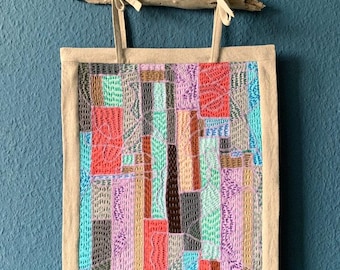 Quilt wall hanging with sashiko embroidery technique. Abstract landscape. 100% handmade. Patchwork quilt as wall decor, mural, or tapestry.