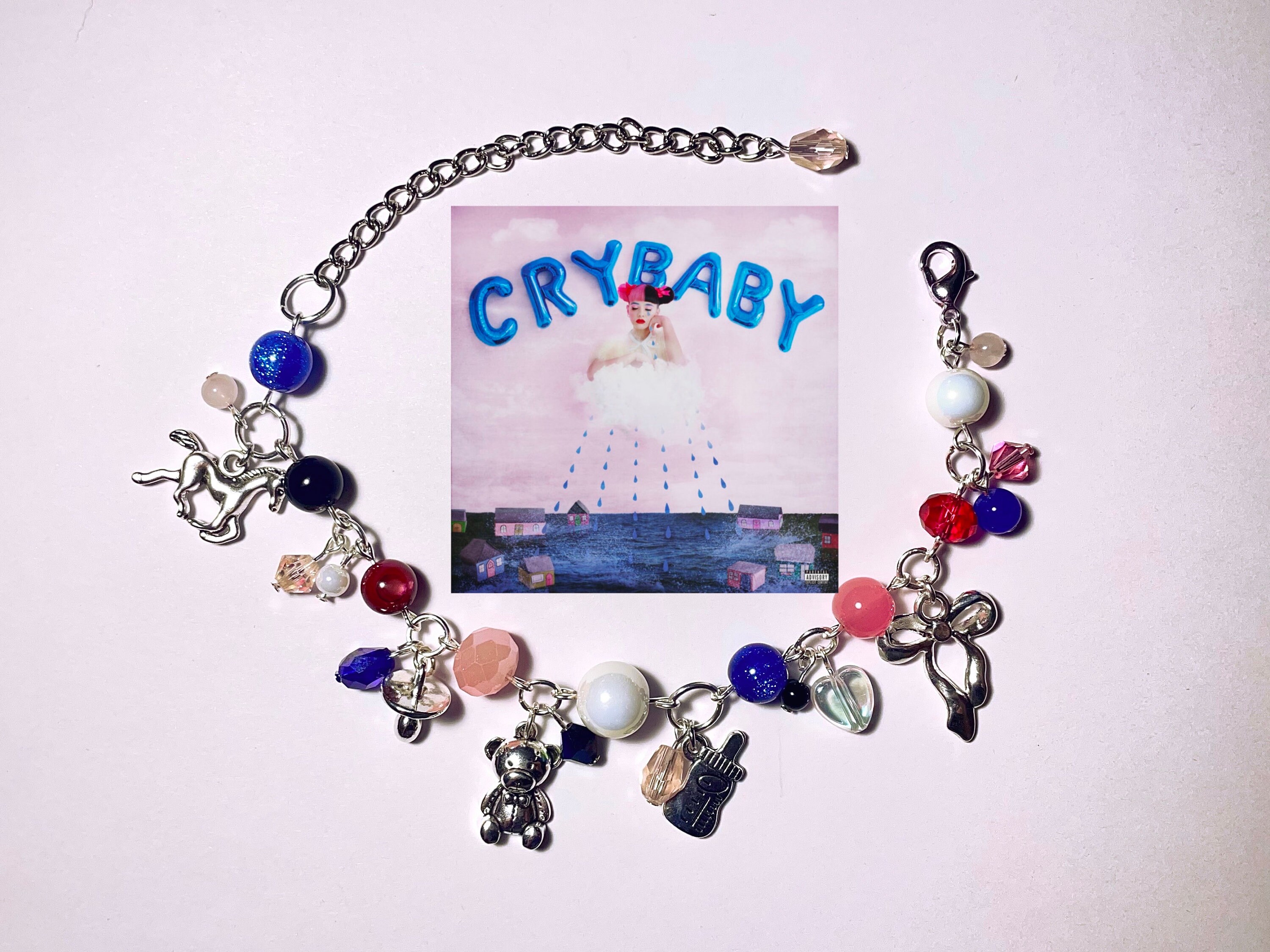 MELANIE MARTINEZ TRILOGY CHARM BRACELET