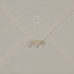 May include: A light beige envelope with a stylized illustration of a cougar and the letter "R". The cougar is in a walking pose, and the letter "R" is in the upper center of the envelope.