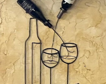 Metal art wine racks with artistic designs, showcasing two wine glasses, grape clusters, and a holder for two bottles. Great gifts ideas