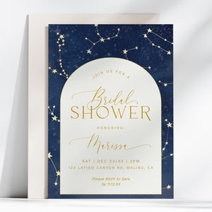 May include: A white card with a navy blue background and gold stars and constellations. The text on the card reads "Join us for a Bridal Shower Honoring Marissa Sat Dec 23/XX 2PM 123 Latigo Canyon Rd, Malibu, CA Please RSVP to Sara by 1112 XX"