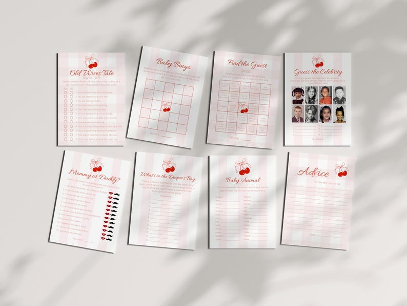 May include: A collection of eight baby shower game printables. Each sheet features a pink and white striped background with red cherry illustrations. Games include "Old Wives Tale," "Baby Bingo," and "Guess the Celebrity."