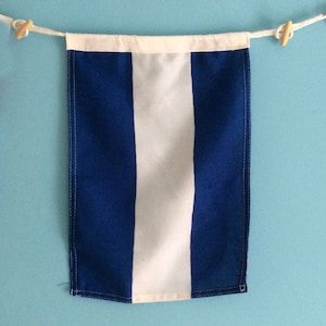 Bandera de señales náuticas "J"