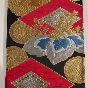 Lot of two 12” x 24” Obi sash pieces glued to a stretched canvas art frame