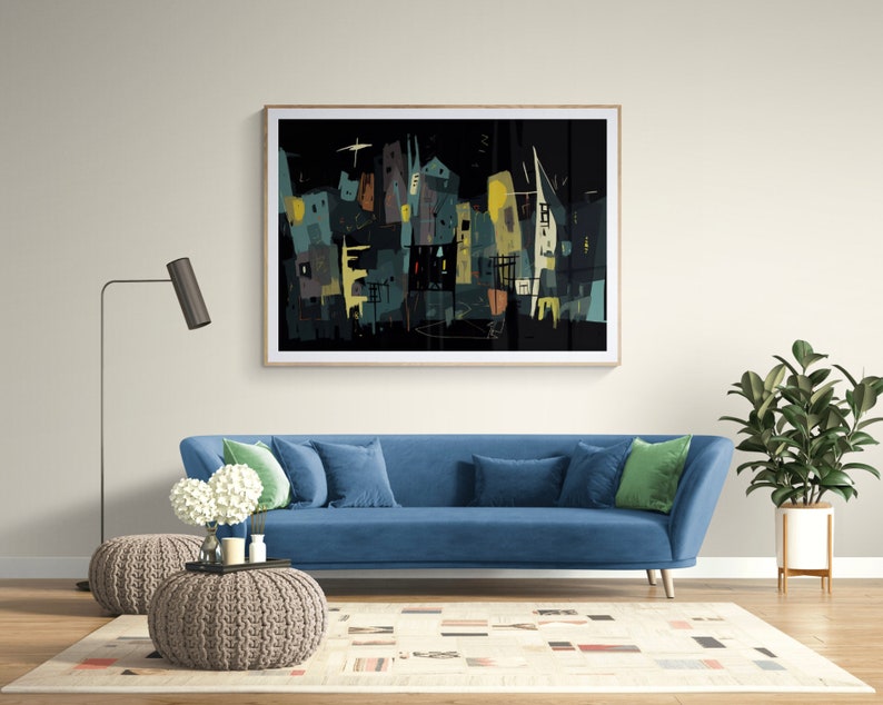 May include: Abstract art print featuring a cityscape in shades of teal, yellow, and brown against a black background. The artwork is framed and hangs above a blue sofa with pillows. A floor lamp and potted plant complete the room.