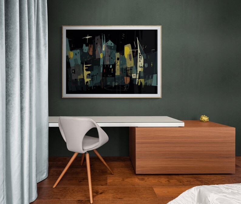 May include: An abstract cityscape art print in a wooden frame hangs above a modern desk. The artwork features buildings in shades of teal, yellow, and black against a dark background. A gray chair with wooden legs sits in front of the desk.