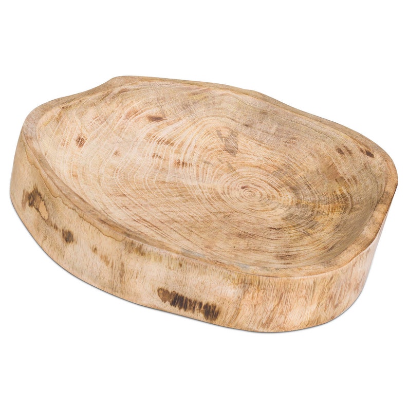 May include: A large, oval-shaped wooden serving bowl with a natural wood finish. The bowl has a rustic, organic look and is perfect for serving snacks, dips, or salads.