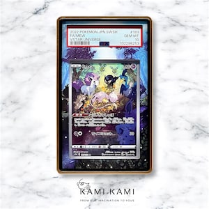 May include: A graded Pokemon trading card featuring a pink and purple Mew Vstar with a blue and green background. The card is graded GEM MT 10 and has the text "2022 POKEMON JPN.SWSH FA/MEW VSTAR UNIVERSE #183 102296253" on the top right corner.