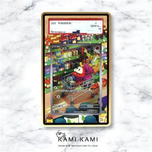 May include: A graded Pok&eacute;mon card with a vibrant illustration of a red creature in a shopping cart. The card is in a gold frame, with a grade of 10. The background is white marble. The card's text includes the word 'Pokemon'.