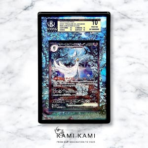 K&ouml;nnte beinhalten: Eine holografische Pokemon-Sammelkarte mit Gardevoir EX auf blau-wei&szlig;em Hintergrund. Die Karte wurde von Beckett Grading Services mit 10 bewertet. Die Karte ist in einwandfreiem Zustand.