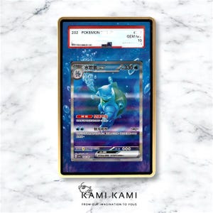 May include: A graded Pok&eacute;mon trading card featuring a blue Blastoise character with Japanese text. The card is encased in a gold-framed holder with a blue background and a GEM MINT 10 grade.