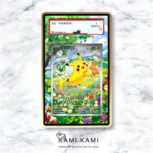 May include: A framed Pok&eacute;mon trading card featuring Pikachu and other characters in a vibrant, colorful scene. The card is encased in a gold-colored frame, with text visible at the top and bottom. The card is graded GEM M 10.