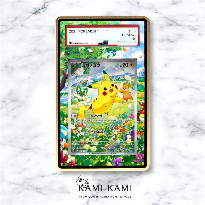 May include: A framed Pok&eacute;mon trading card featuring Pikachu and other characters in a vibrant, colorful scene. The card is encased in a gold-colored frame, with text visible at the top and bottom. The card is graded GEM M 10.