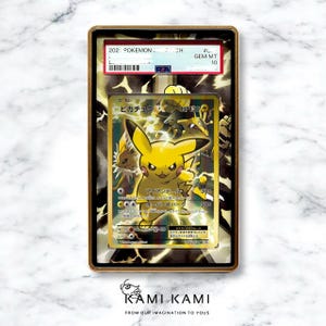 May include: A graded Pok&eacute;mon trading card featuring Pikachu. The card is encased in a gold-colored frame with the text "GEM MT 10". The card has Japanese text and illustrations of Pikachu and other characters.