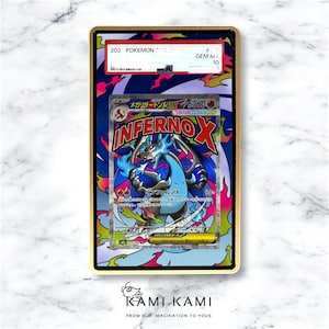 May include: A graded Pok&eacute;mon card featuring a blue and black dragon with the word "INFERNOX" in red and white. The card is encased in a gold-framed holder with the text "202 POKEMON" and "GEM MINT 10". The card has Japanese text.