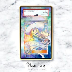 May include: A graded Pok&eacute;mon card featuring the character Lillie, with Japanese text, in a gold-coloured case. The card has a colourful background and the text "TRAINER'S" is visible. The card is graded GEM MINT 10.