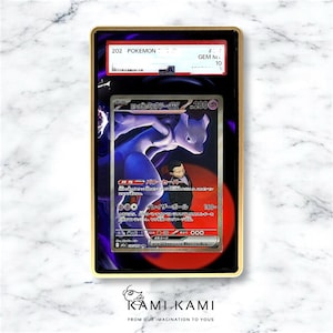 May include: A graded Pok&eacute;mon card featuring a purple Mewtwo character with Japanese text. The card is encased in a black holder with gold trim, displaying a grade of 10. The background is a marble pattern.
