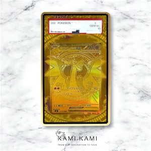 May include: A gold-colored Pokémon card encased in a gold frame. The card features a golden dragon illustration with Japanese text and the number 360. The frame has a black border and a red and white label at the top.