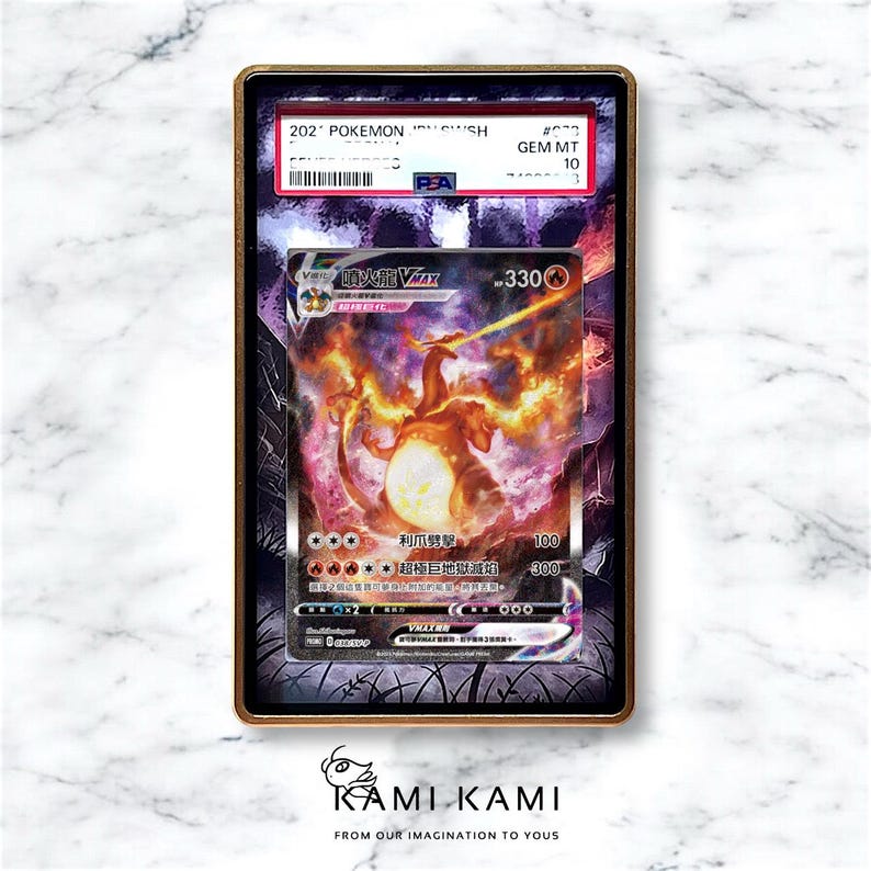 May include: A graded Pok&eacute;mon card featuring Charizard VMAX, with a fiery orange and yellow illustration. The card is encased in a gold-framed holder with the text "GEM MT 10". The card's details include Japanese text and a PSA authentication label.