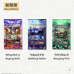 May include: Three Pokemon cards in acrylic frames. The cards are holographic and feature the Pokemon Raging Bolt, Walking Wake, and Gouging Fire. The text "New Edition" is at the top of the image.