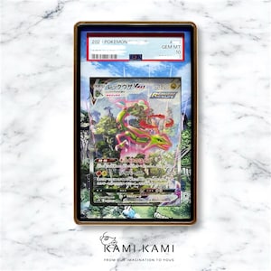 May include: A graded Pokemon trading card featuring a green and pink Rayquaza VMAX with the text "レックウザ VMAX" and "320" in Japanese. The card is graded GEM MT 10 by PSA.