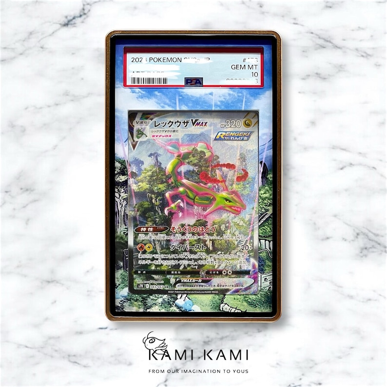 May include: A graded Pokemon trading card featuring a green and pink Rayquaza VMAX with the text "レックウザ VMAX" and "320" in Japanese. The card is graded GEM MT 10 by PSA.