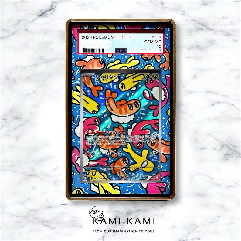 May include: A Pokemon trading card featuring a blue, yellow, and pink cartoon design with a holographic finish. The card is graded GEM MT 10 by PSA. The card is encased in a protective plastic case.