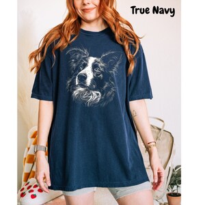 a woman wearing a t - shirt with a dog on it