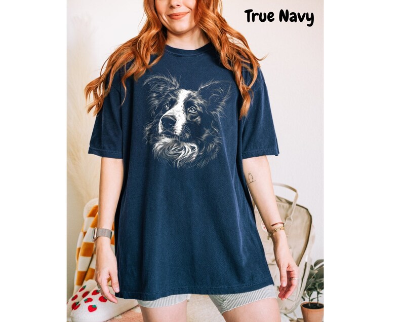 a woman wearing a t - shirt with a dog on it