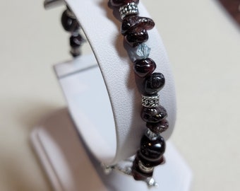 Handmade beaded bracelet.  Garnet gemstone nuggets with Crystal Passions bicones and silver-plated pewter rondelles