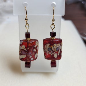 Handmade dangle earrings - red rectangle 21mm x 18mm focal beads adorned with tan swirls