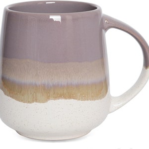 May include: A ceramic coffee mug with a light purple, beige, and white glaze. The mug has a rounded body and a wide handle.