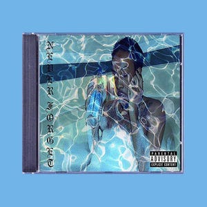May include: CD case with album art featuring a person in water, holding a blue bottle. The album title "Never Forget" is vertically printed in gothic font. A parental advisory warning is visible.