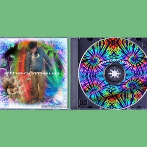 May include: A CD case with a tie-dye design on the disc and cover art featuring a person and the text "#thecomeup". The disc has a black center and the case is open.