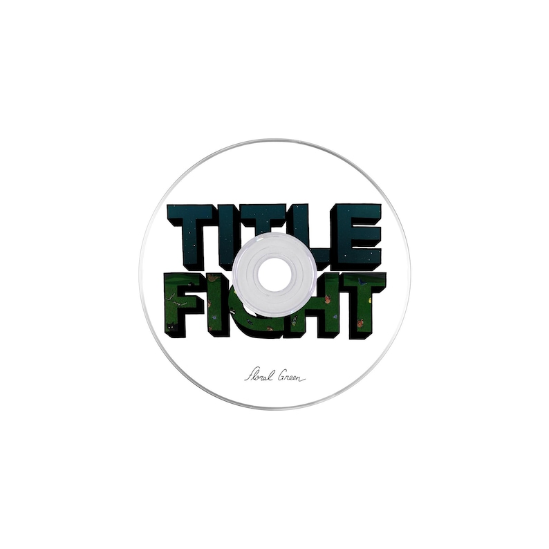 May include: A white CD with a black and green graphic that says "TITLE FIGHT" with the text "Floral Green" below the graphic.