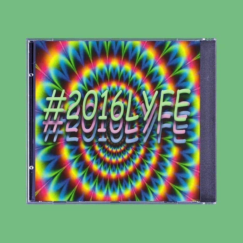 May include: A CD case with a psychedelic design. The cover features a swirling pattern of rainbow colors, with the text "#2016LYFE" in green and pink. The case is set against a green background.